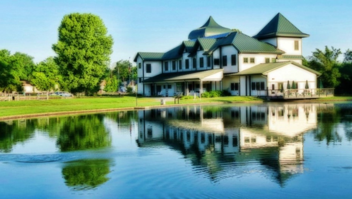The Neosho National Fish Hatchery visitor center reflected in the pond