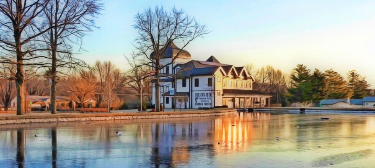 The Neosho National Fish Hatchery visitor center at dusk in winter